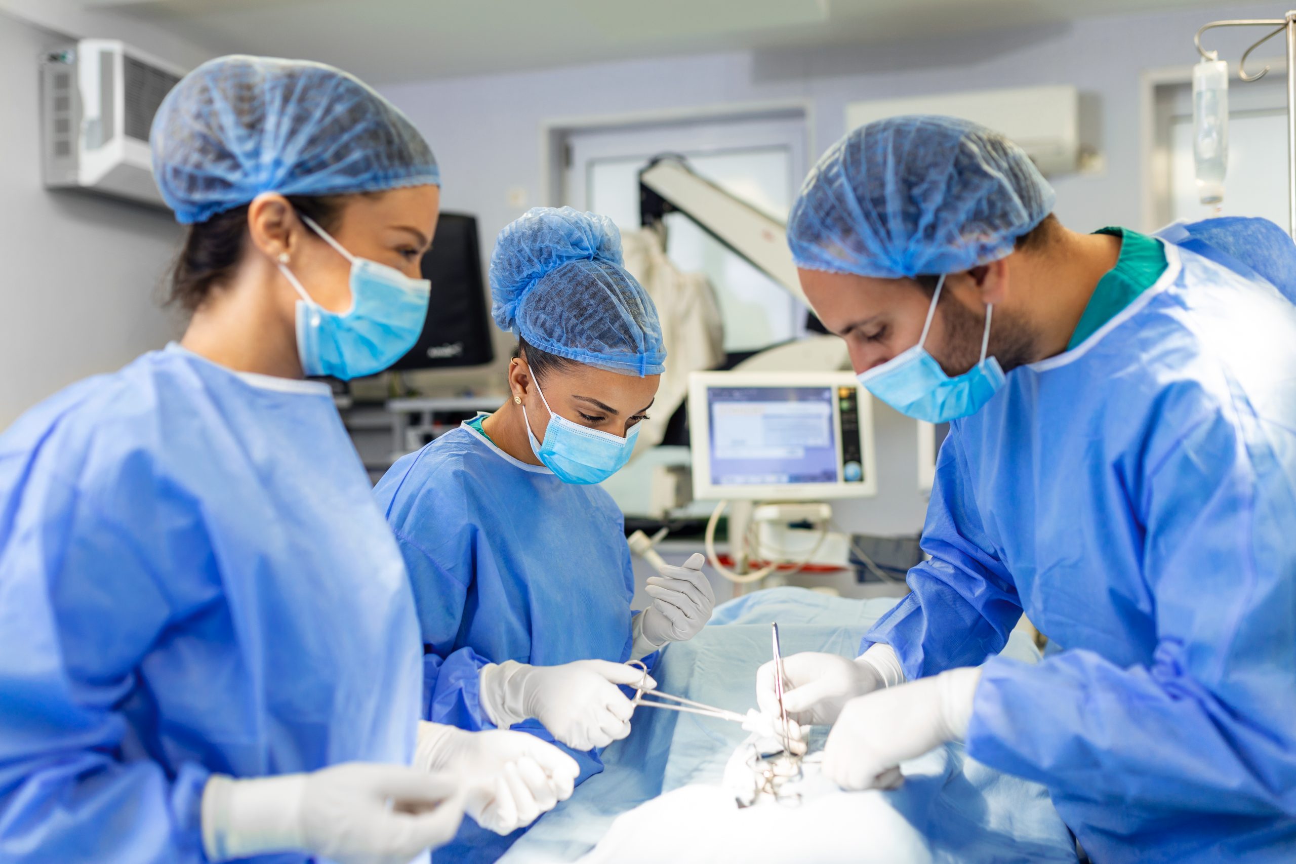 Group of surgeons doing surgery